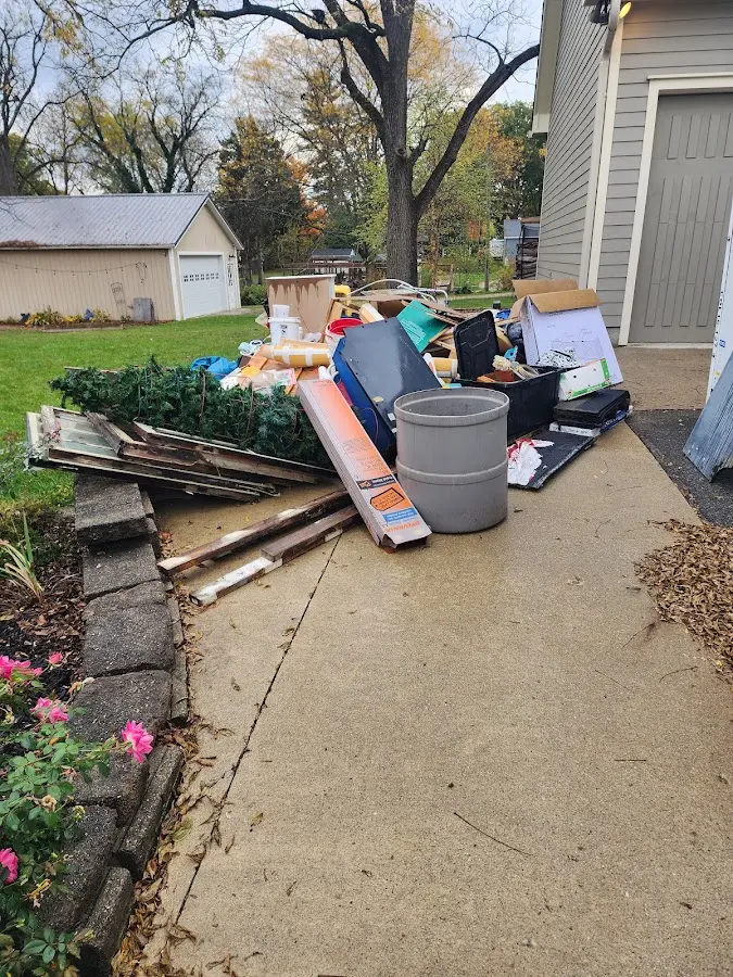 Dumpster being loaded with debris for Demolition Dumpster Rental in Mill Creek East